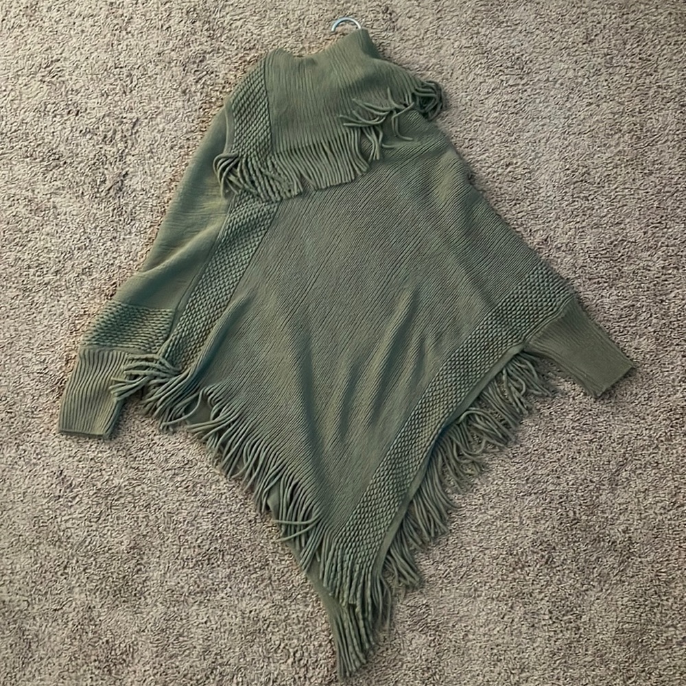 Green turtleneck poncho sweater